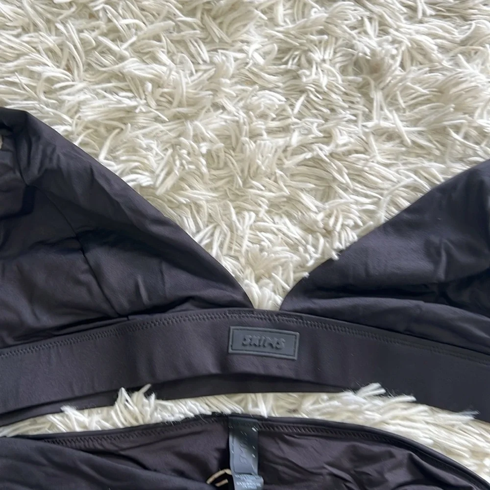SKIMS SWIM PLUNGE BIKINI TOP AND MID WAIST BOTTOM IN ONYX